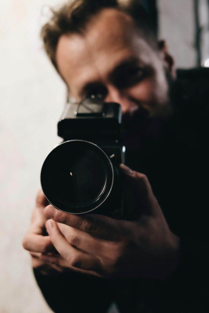 medium format photographer with a hasselblad camera closeup